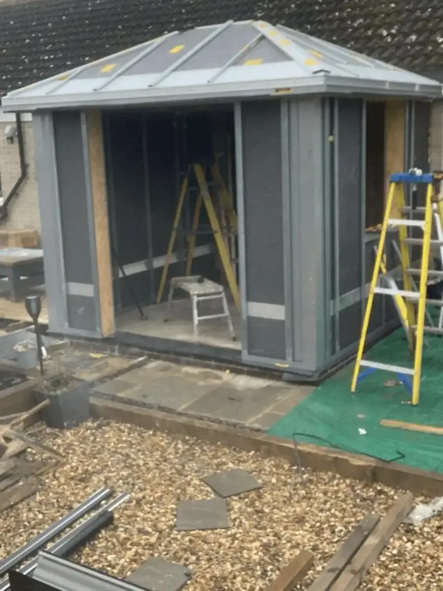Certified HUP! installers setting up the rapid wall panel grid on a clean residential job site. Work by Norfolk Exterior Solutions